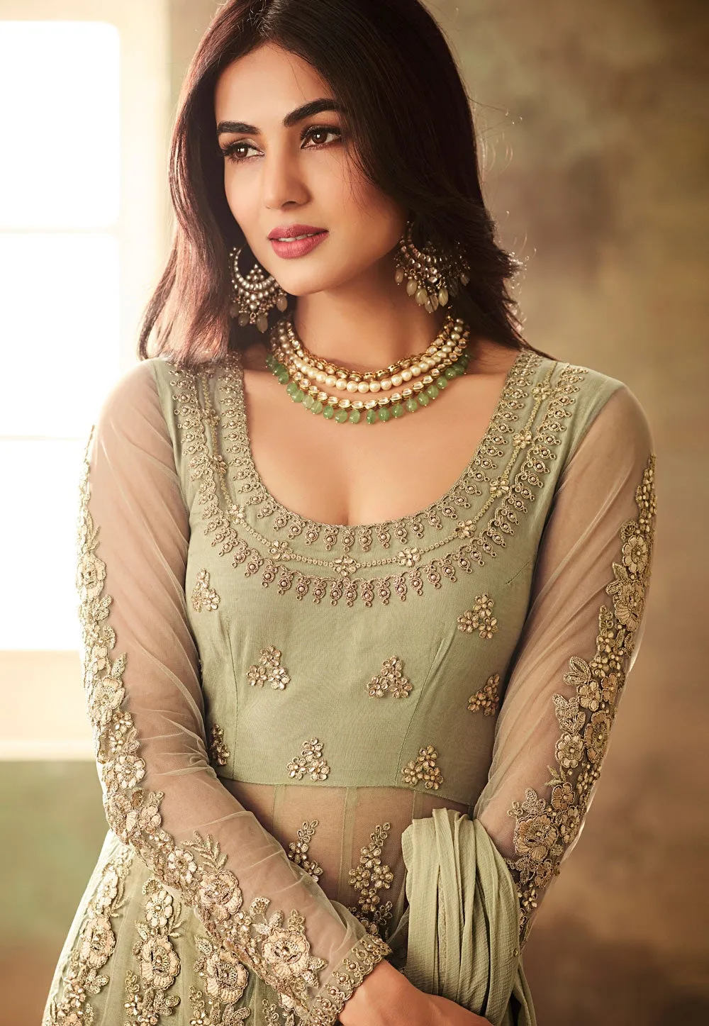 Light Green Net Embroidered Kurta And Pant Suit